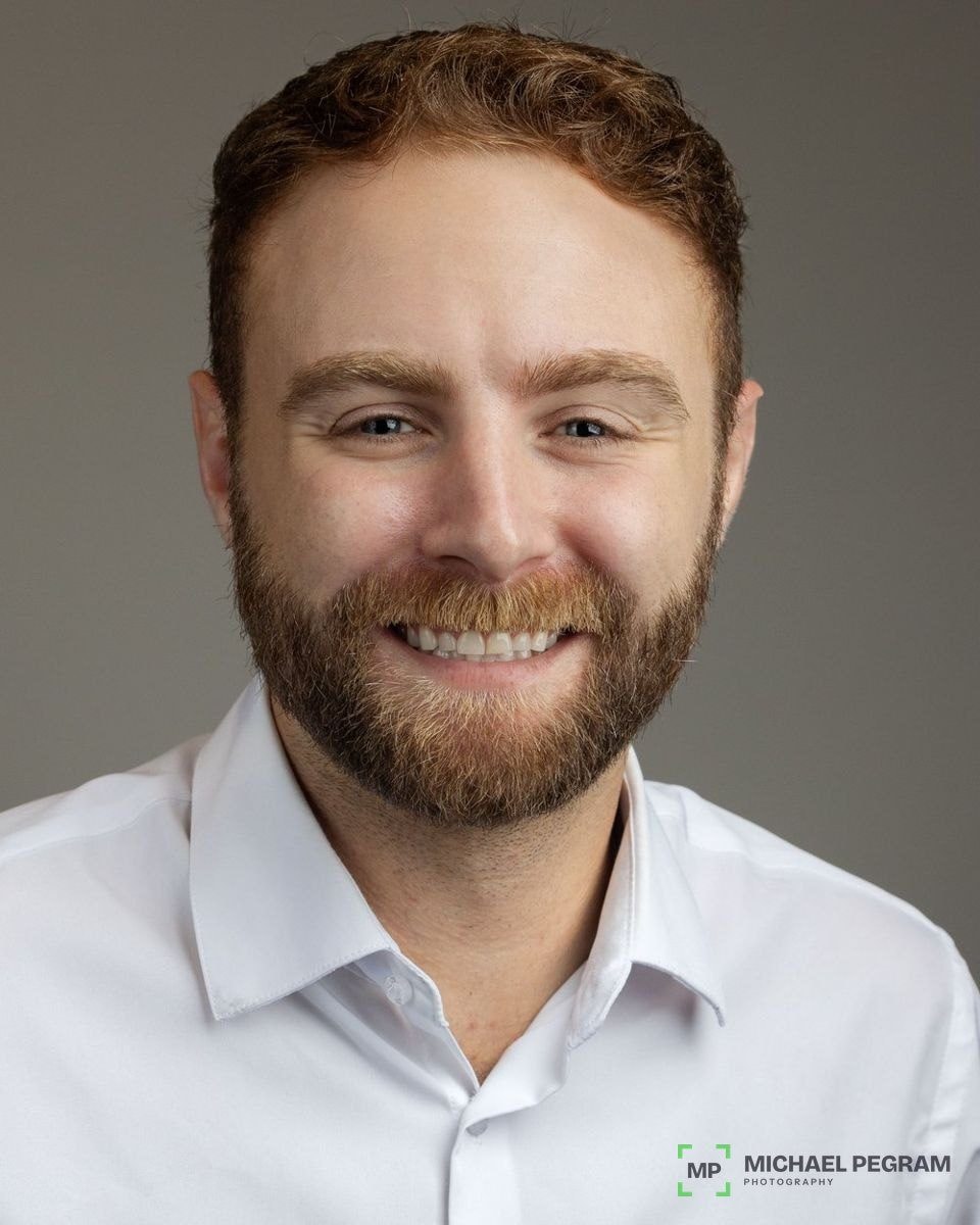 Headshot with the dark and green watermark in the bottom right corner