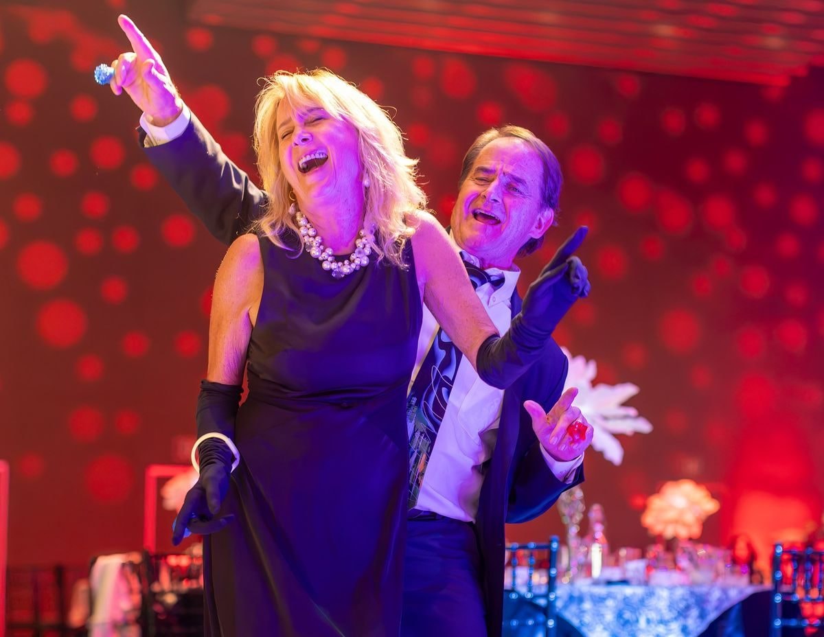 Guests laughing and dancing at the California Medical Association Presidential Gala in Sacramento