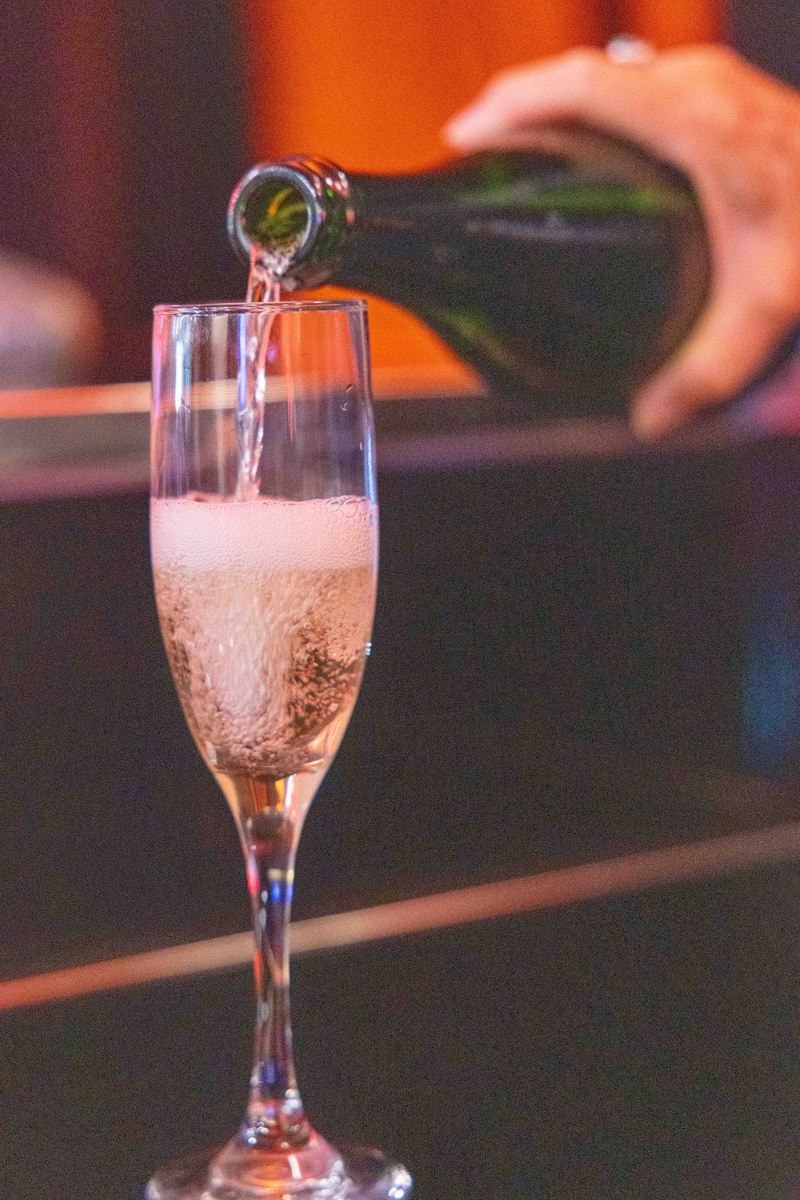 Champagne being poured into a flute at the sponsor champagne station