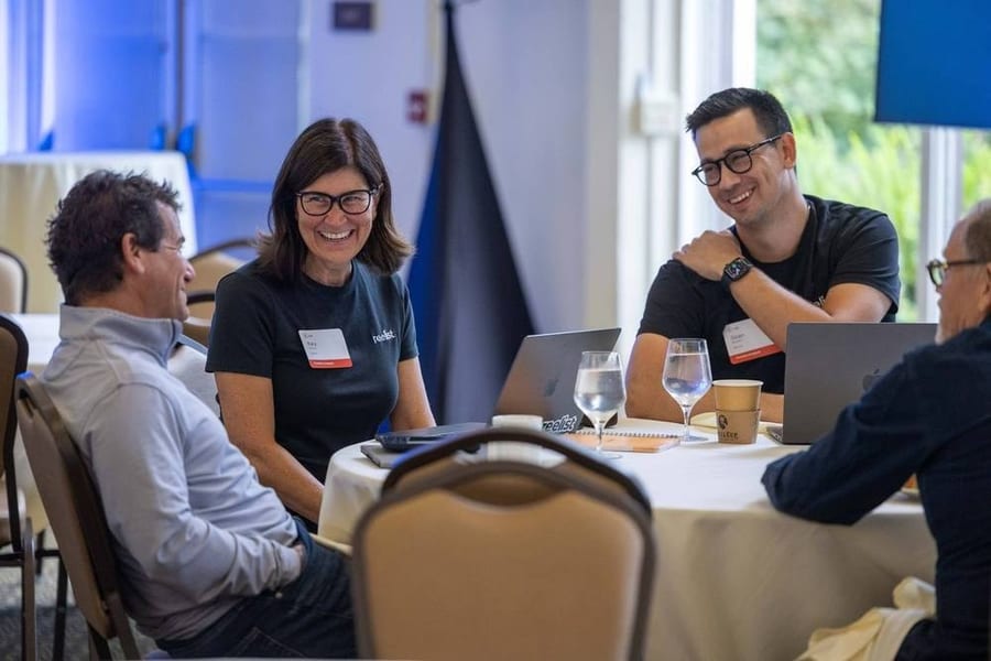 Attendees laughing during a roundtable session at a Bay Area conference — corporate event photography by Michael Pegram