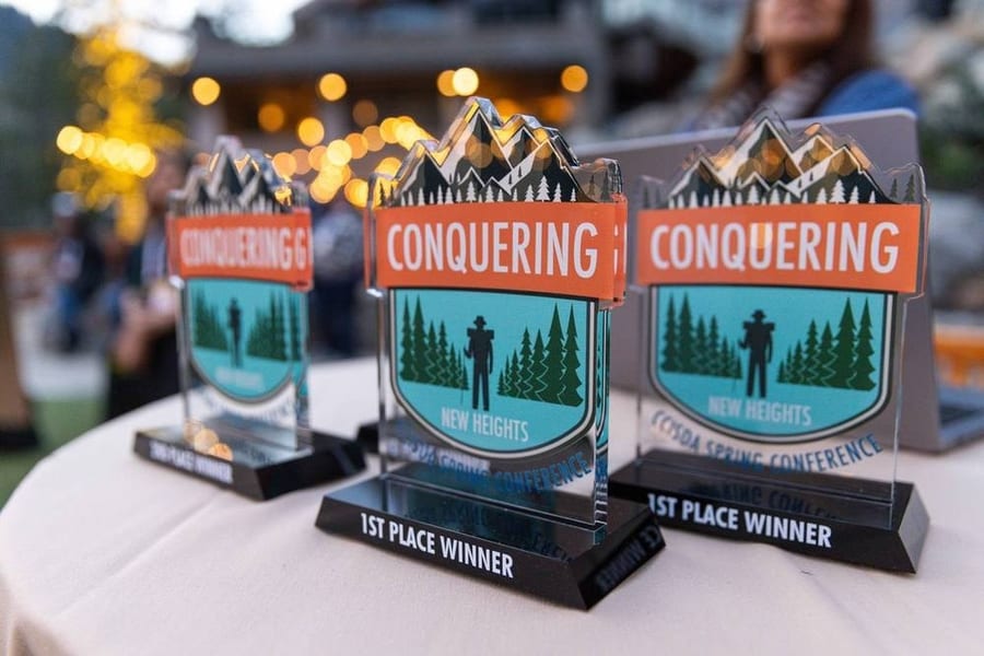 Conquering New Heights conference award trophies on display — corporate event photography by Michael Pegram