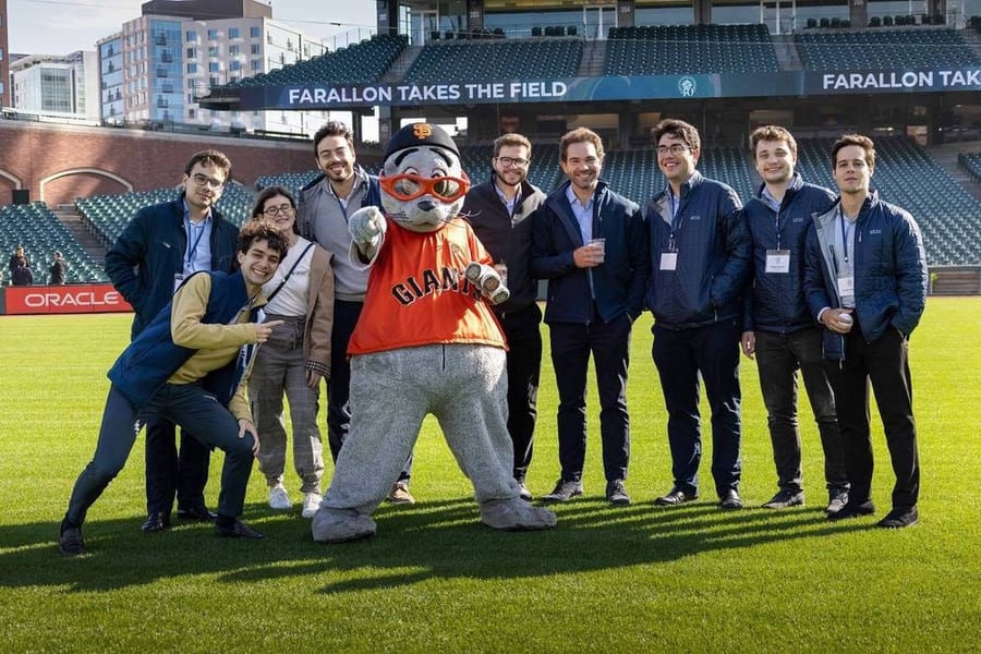 Company team photo with the SF Giants mascot on the field at Oracle Park — corporate event photography by Michael Pegram