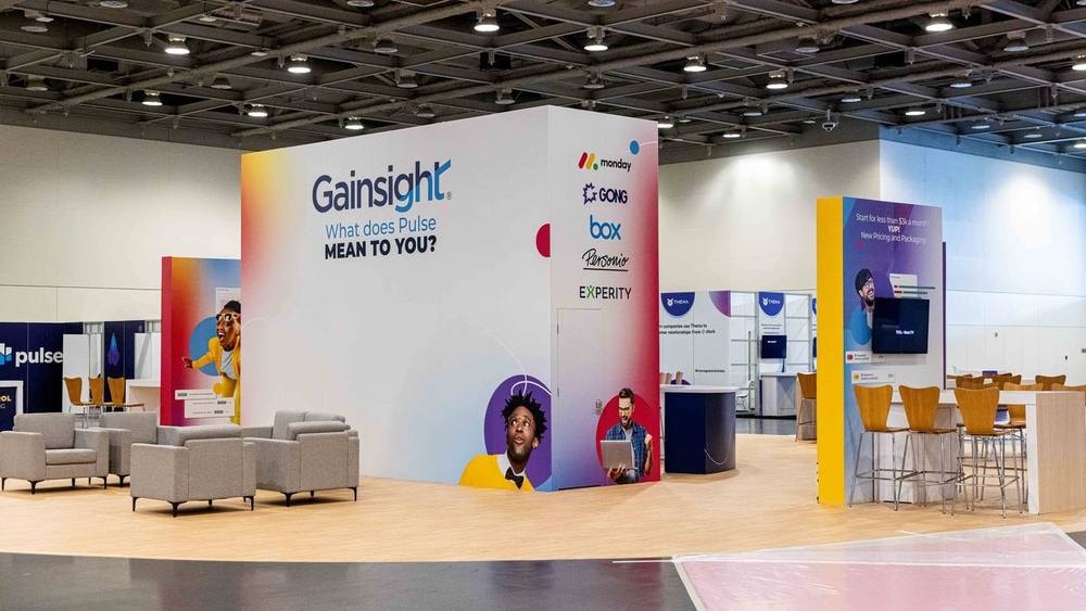 Gainsight Pulse conference expo booth and lounge on the show floor — corporate event photography by Michael Pegram