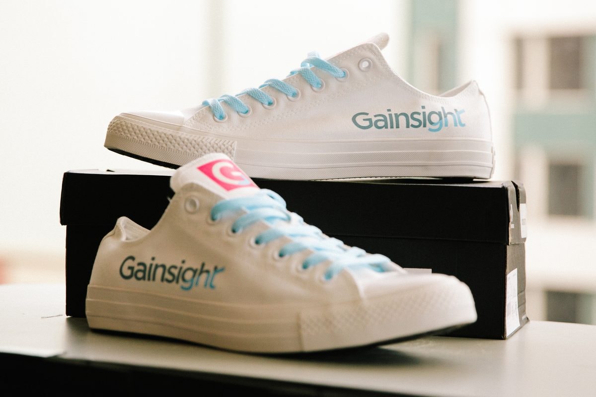 Custom Gainsight-branded sneakers, a branded giveaway at the Gainsight Pulse conference — corporate event photography by Michael Pegram