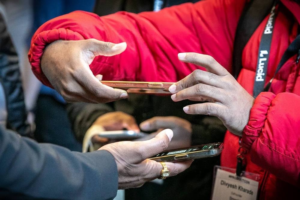 Attendee badge being scanned at conference check-in — corporate event photography by Michael Pegram