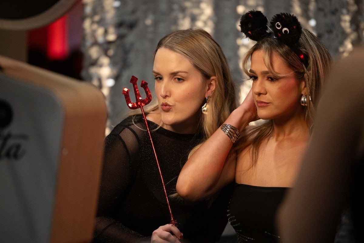 Guests posing playfully with party props at a Farallon Capital holiday party in San Francisco — corporate event photography by Michael Pegram