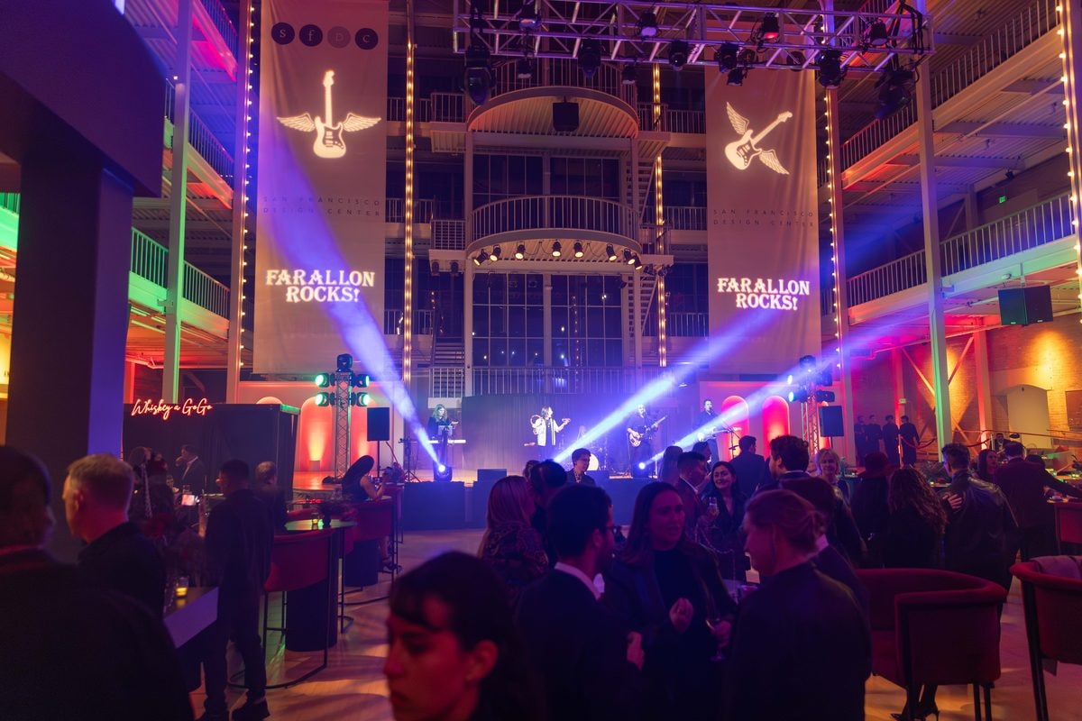 Lasers and a live band over the dance floor at a Farallon Capital holiday party in San Francisco — corporate event photography by Michael Pegram