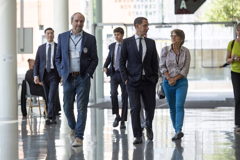 Conference attendees walking through a sunlit venue atrium in San Francisco — corporate event photography by Michael Pegram