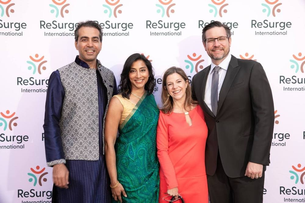 Guests posing at the ReSurge International step-and-repeat at a San Francisco gala — corporate event photography by Michael Pegram
