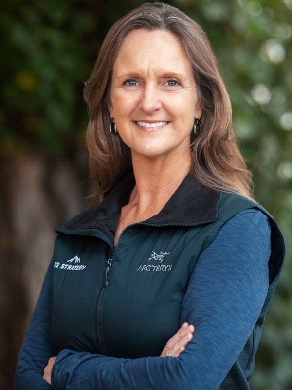 Outdoor corporate headshot of a smiling woman in an Arc'teryx jacket — Bay Area headshot by Michael Pegram