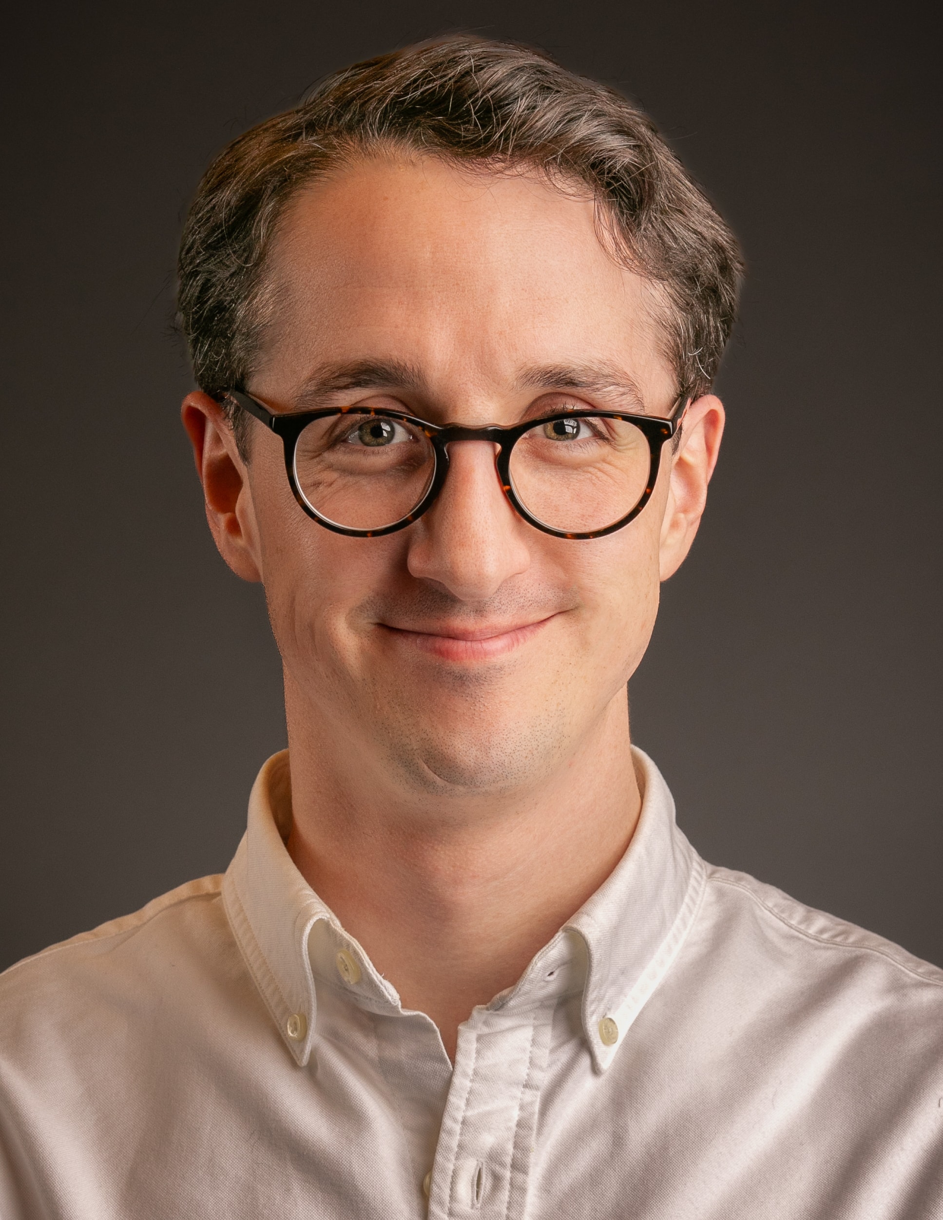 Corporate headshot of a man in a white shirt — professional headshot photography by Michael Pegram