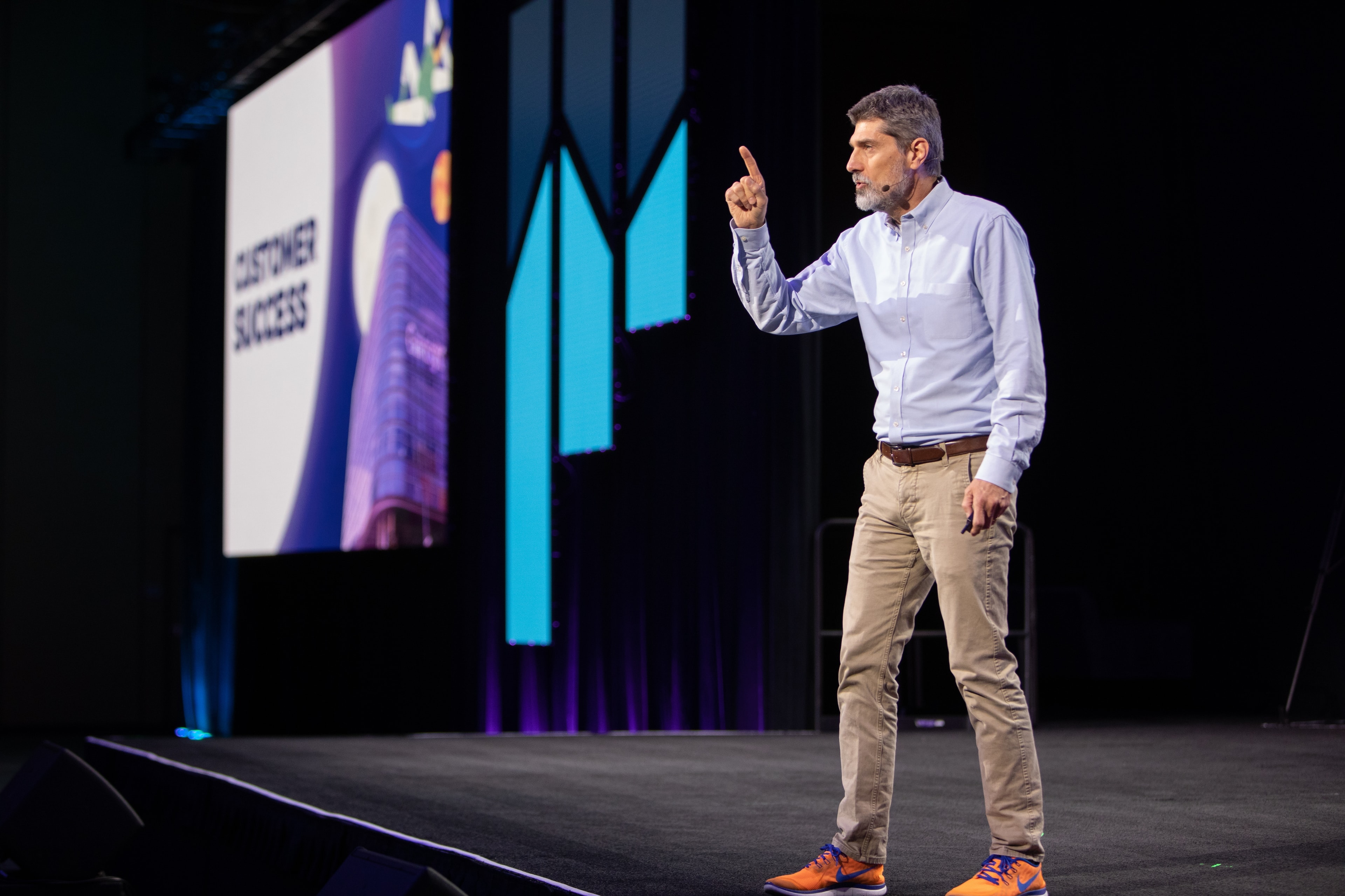 Speaker presenting on stage at corporate conference — Michael Pegram Photography