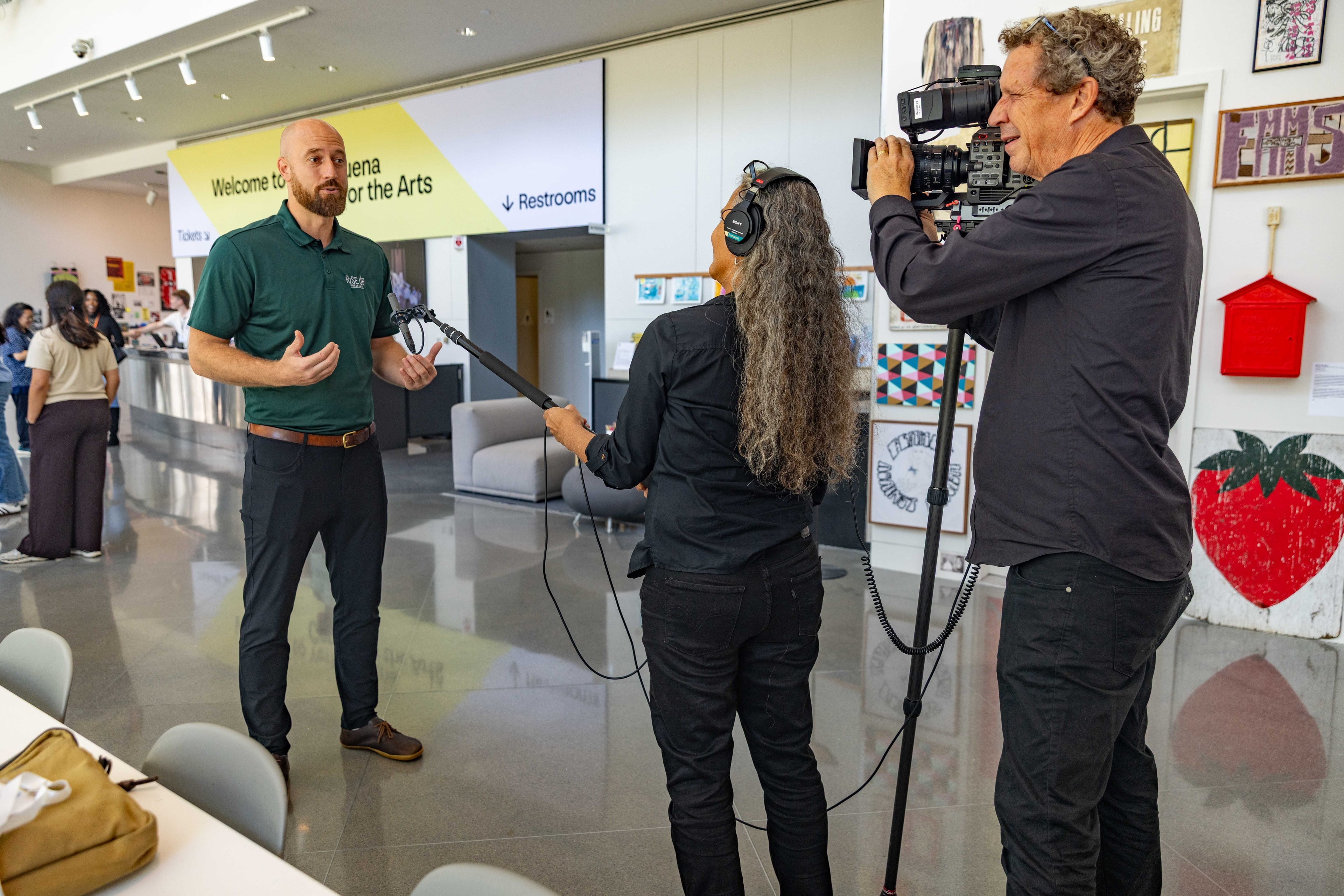 Film crew recording interview at arts center — Michael Pegram Photography