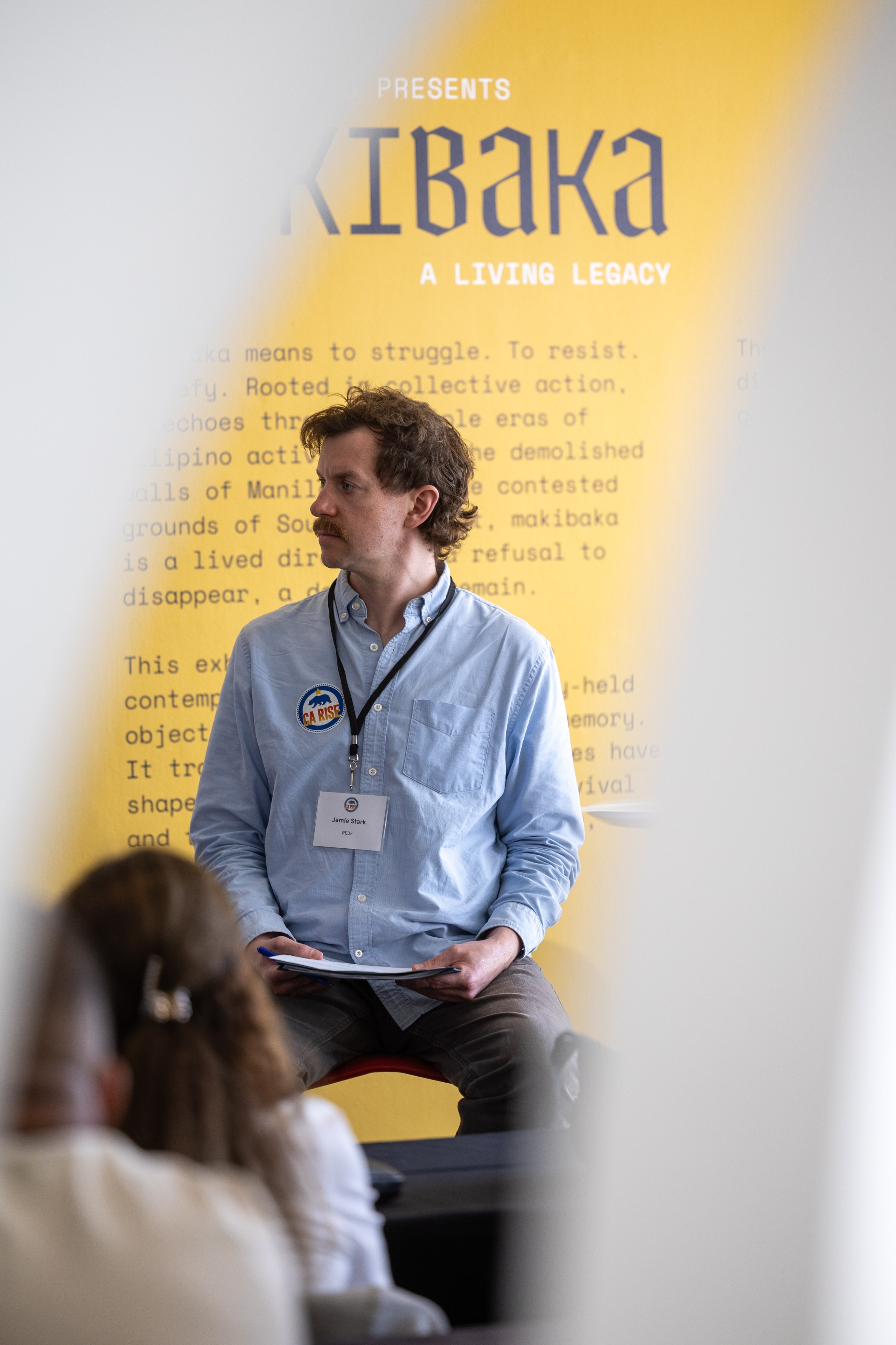 Attendee at Kibaka exhibition event — Michael Pegram Photography