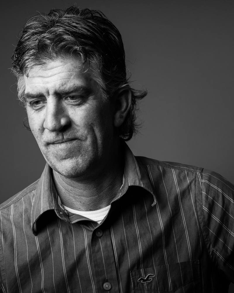 Corporate headshot of a middle-aged man in a striped shirt — San Francisco headshot by Michael Pegram