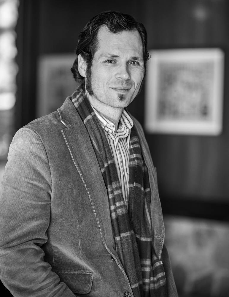Corporate headshot of a man in a blazer and plaid scarf — Bay Area headshot by Michael Pegram