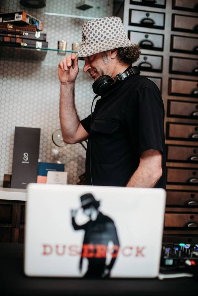 DJ performing at a corporate party — event photography by Michael Pegram